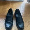 Svarta loafers